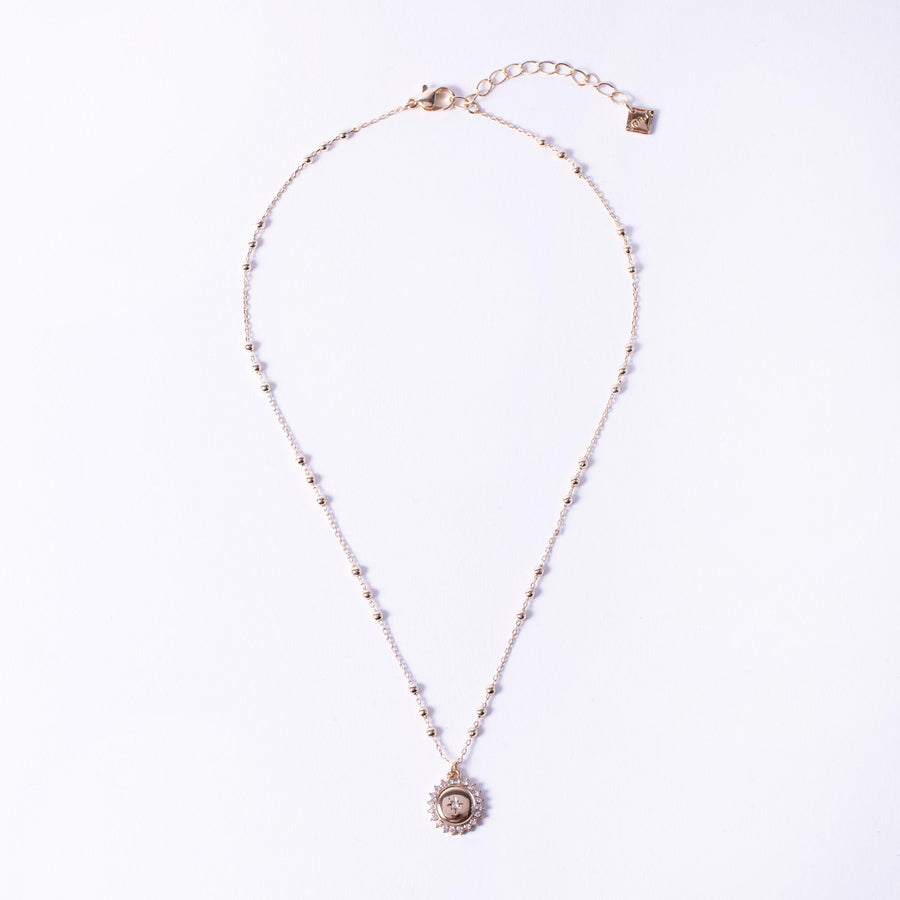 gold crystal pave medallion coin single necklace on station ball chain, jewellery layout